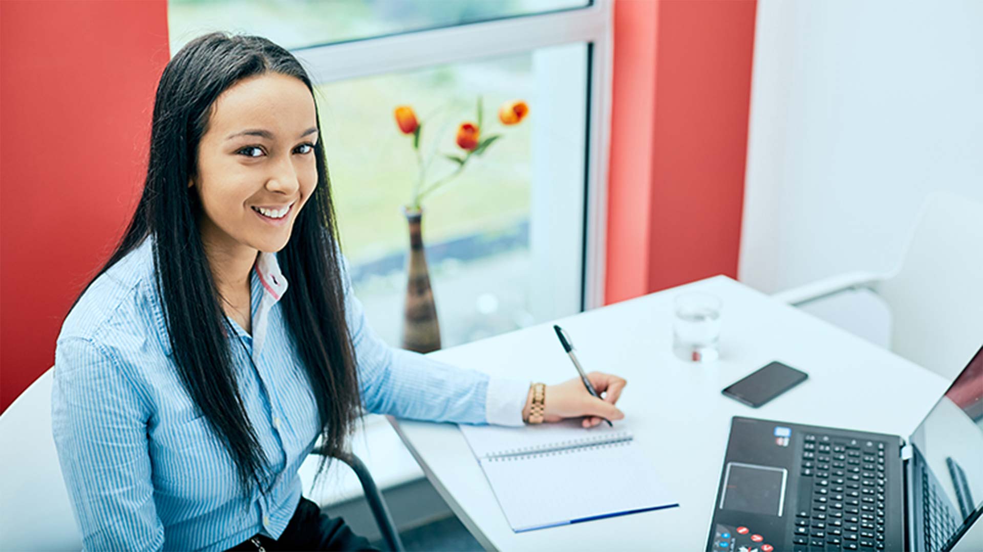 A young female Kirklees College student looking at the camera