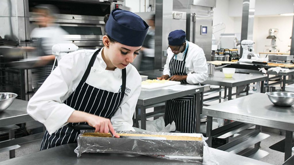 Catering student at Kirklees working in the kitchen