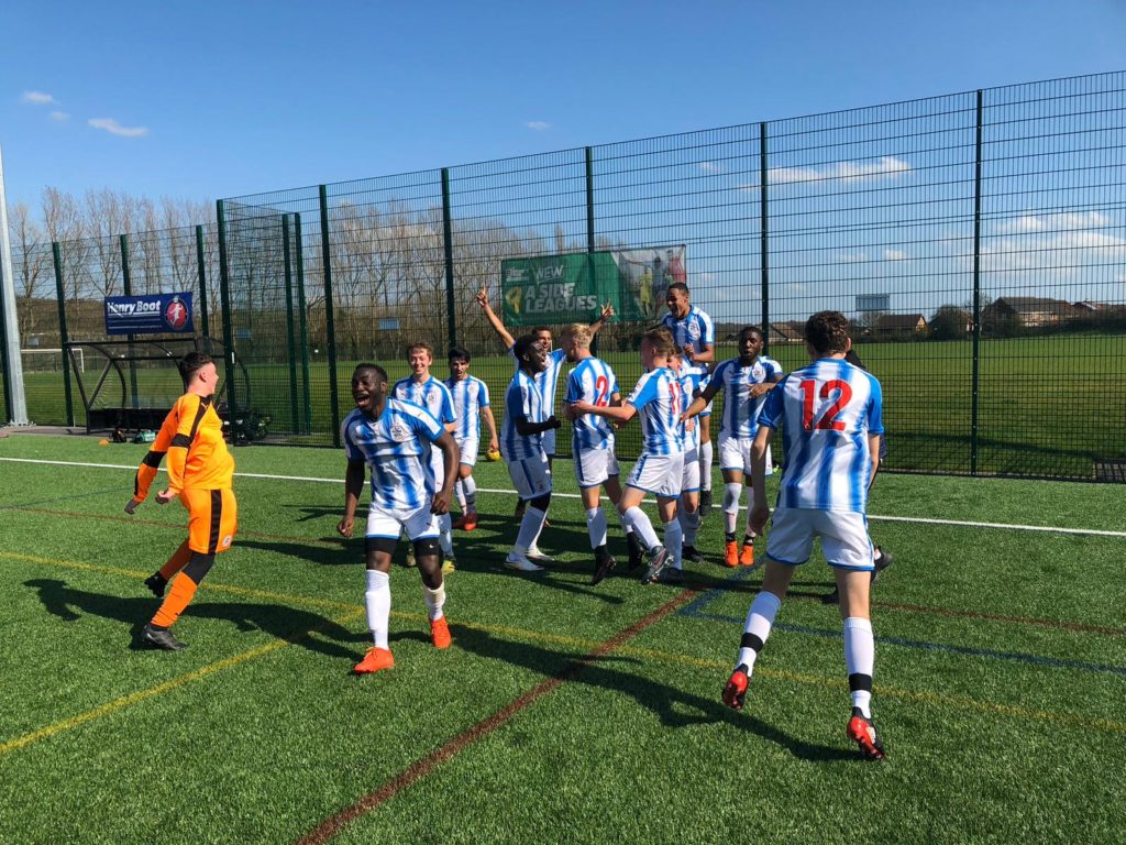 Group of male students playing football