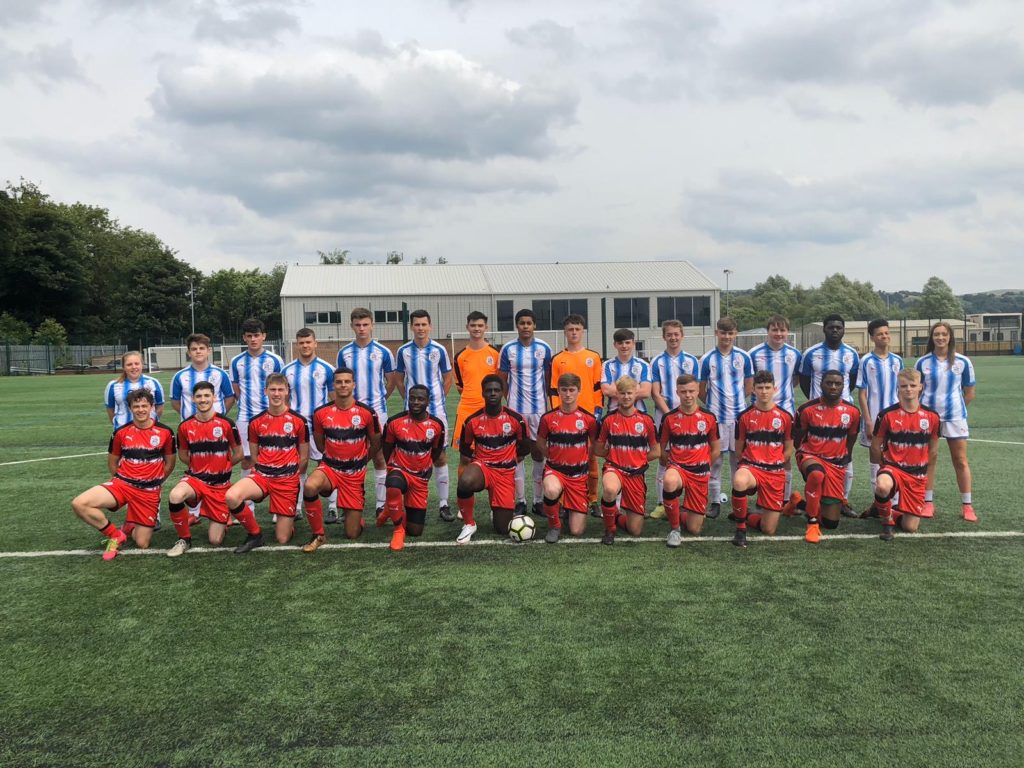 football academy students lined up for a group photo