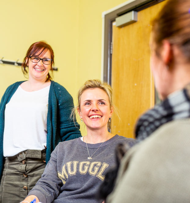 Older students talking in a group