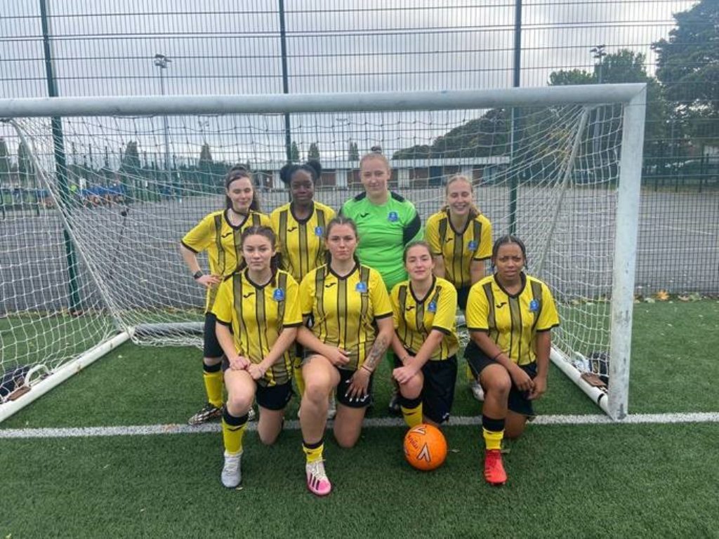 Girls football team having a team photograph