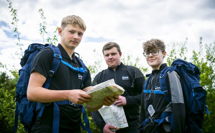 Three male students setting out orienteering