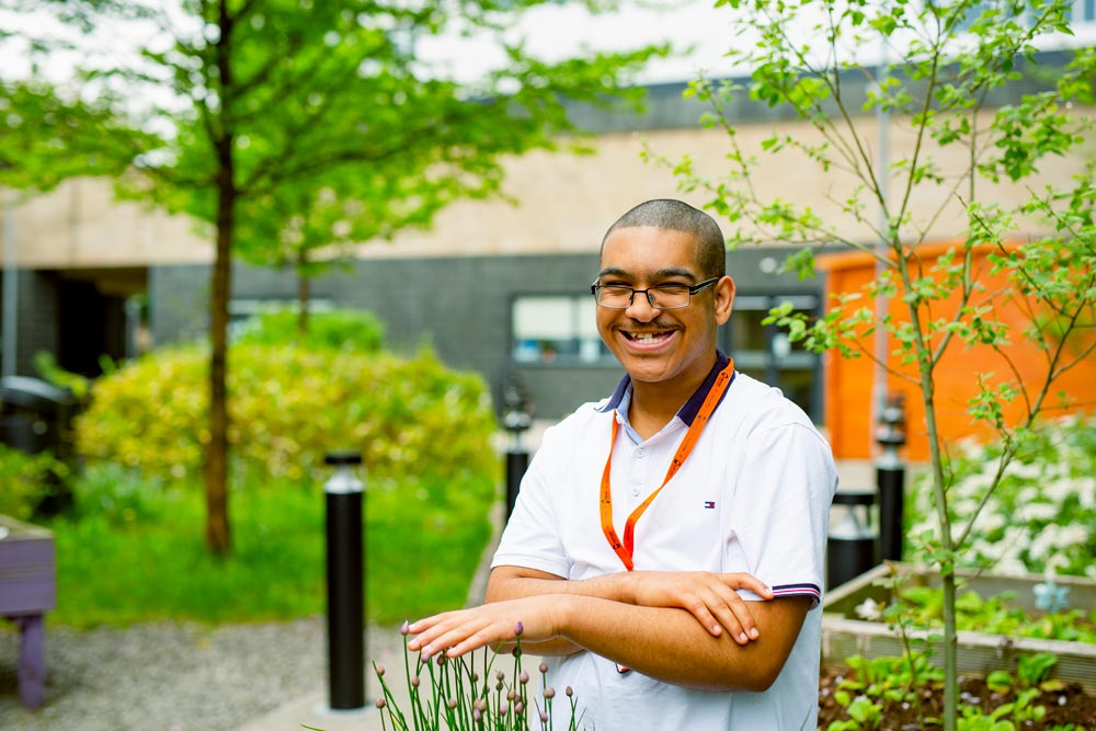 Foundation Learning Student Candid Smile in Sensory Garden