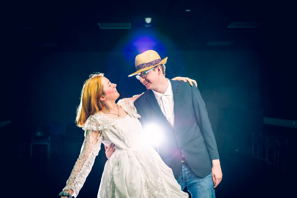 Male and Female Performing Arts Students Wearing Costumes and Dancing