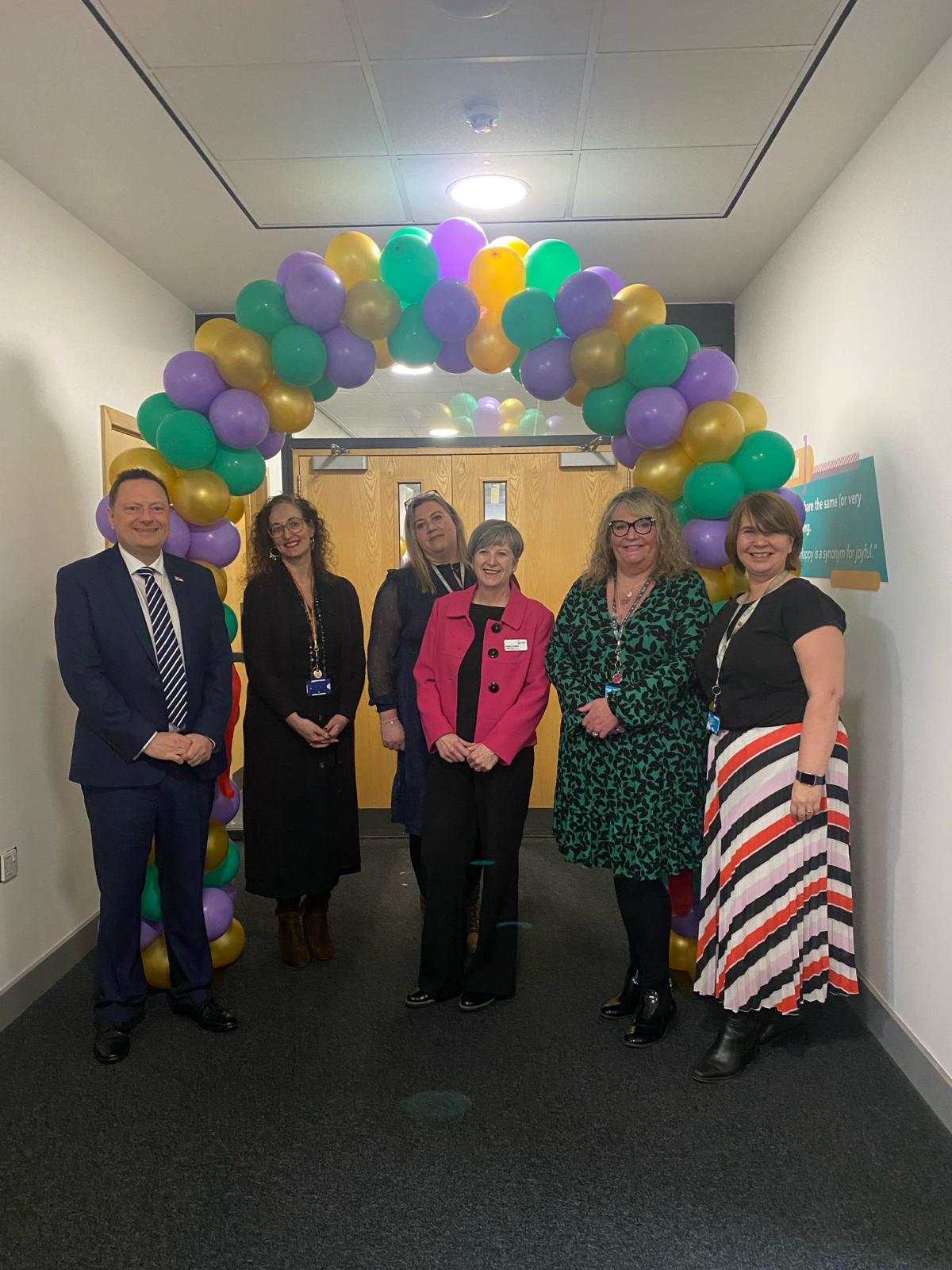 Left to right: Jason McCartney MP, Kay Kaye, Melissa Sykes, Pauline Hughes, Michelle Rich and Lynn Smith under balloon arch