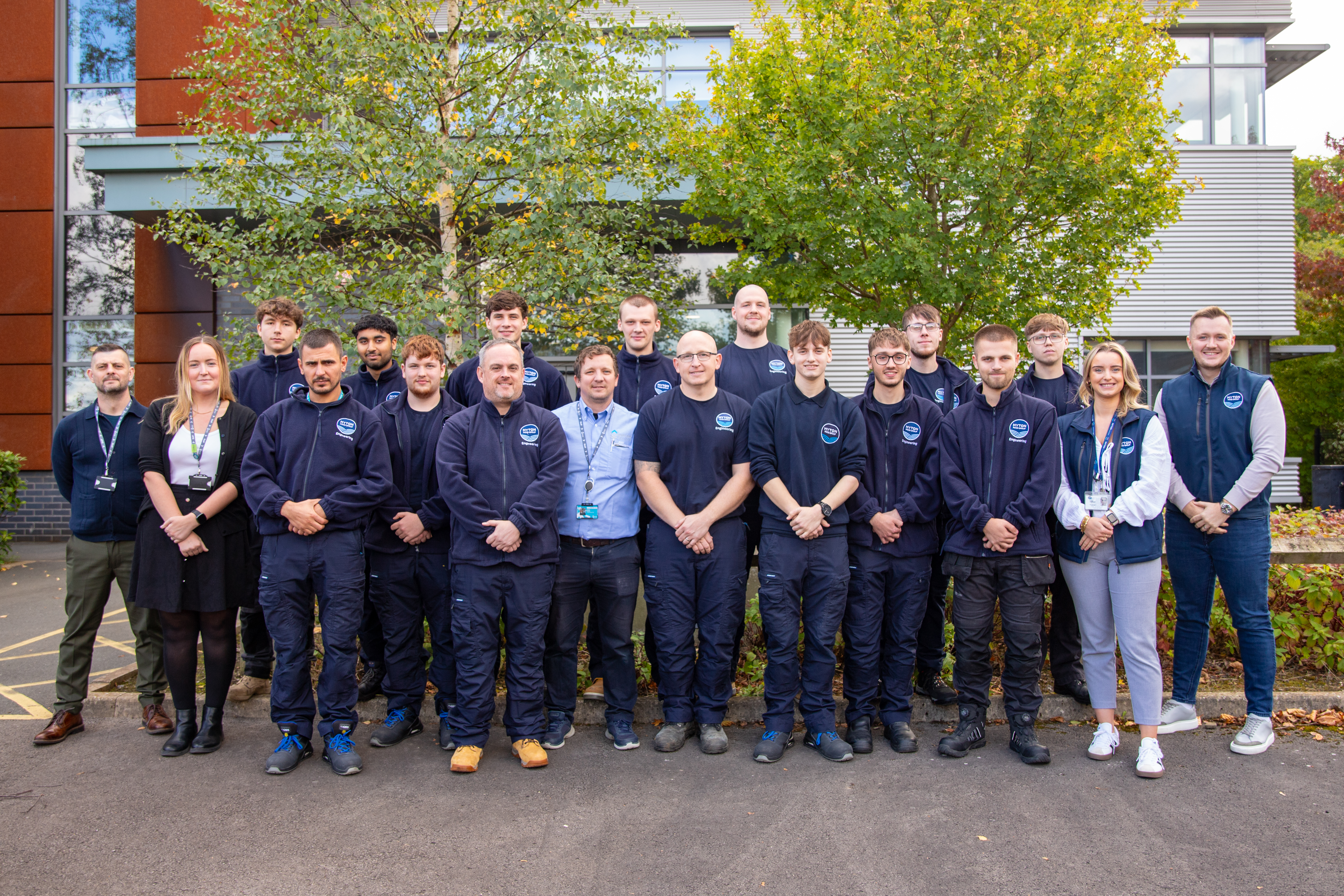 Kirklees College staff and Myton Food Group apprentices stand outside Process Manufacturing Centre