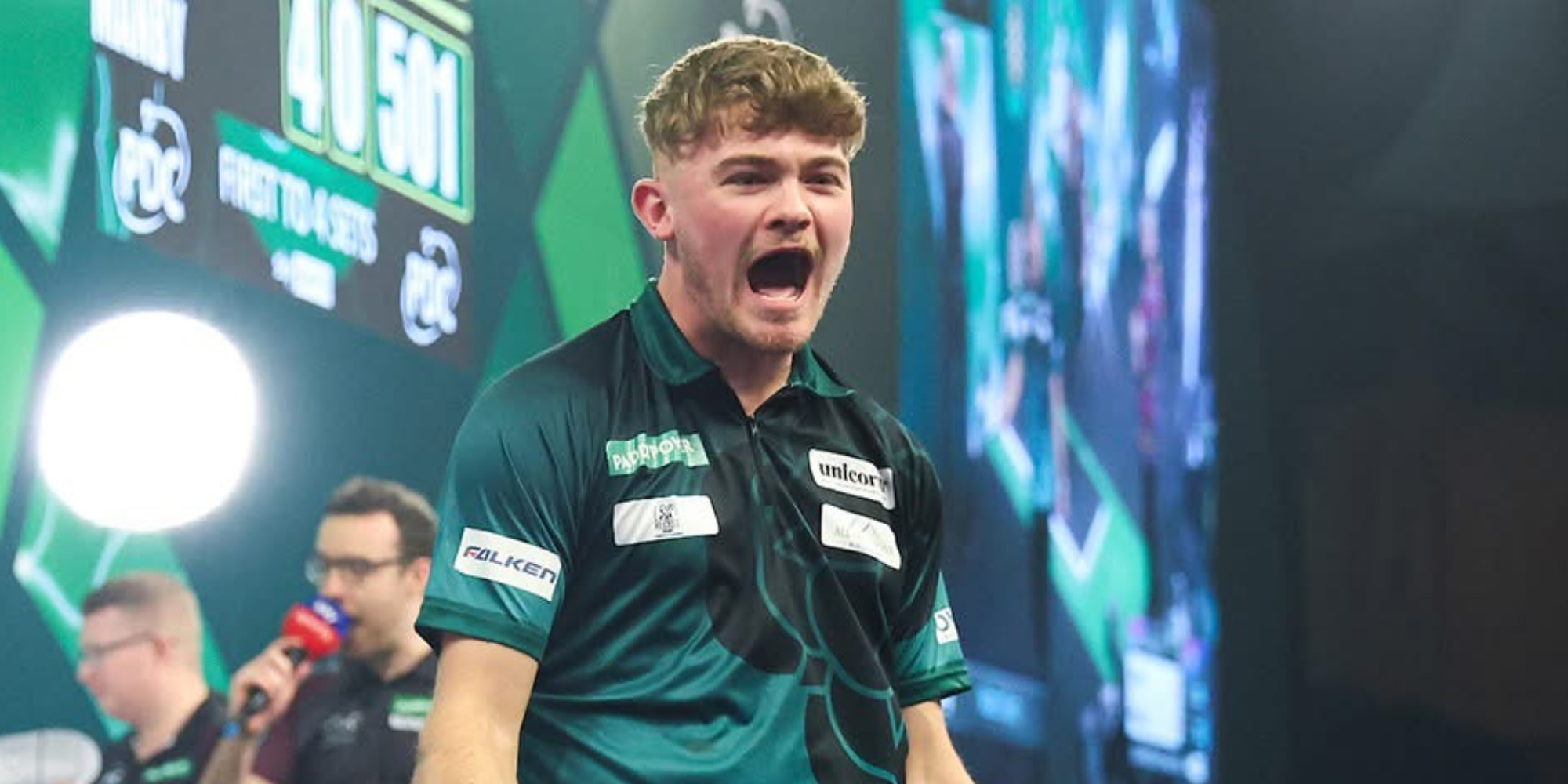 Charlie Manby celebrates winning Darts match