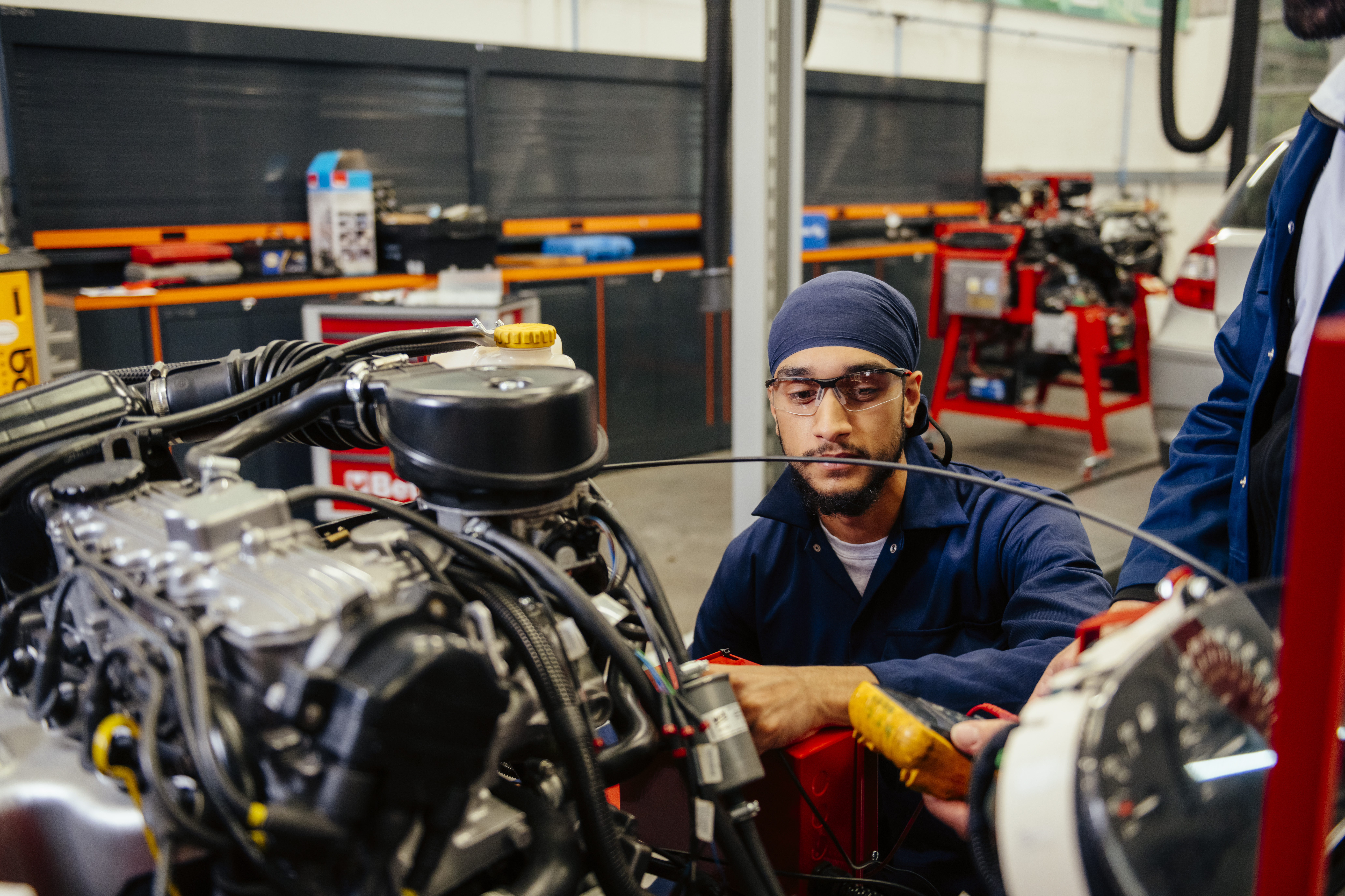 Man in Motor Vehicle workshop