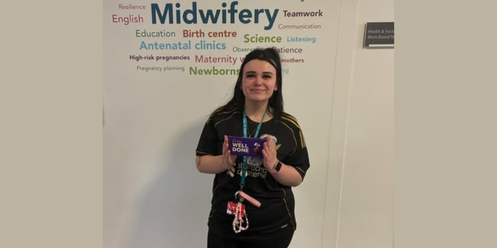 Health and Social Care student poses for picture with prize