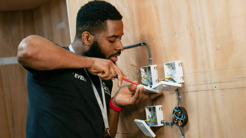 Ethnic Male Electrical Installation Student Training to Become an Electrician at our Brunel Construction Centre