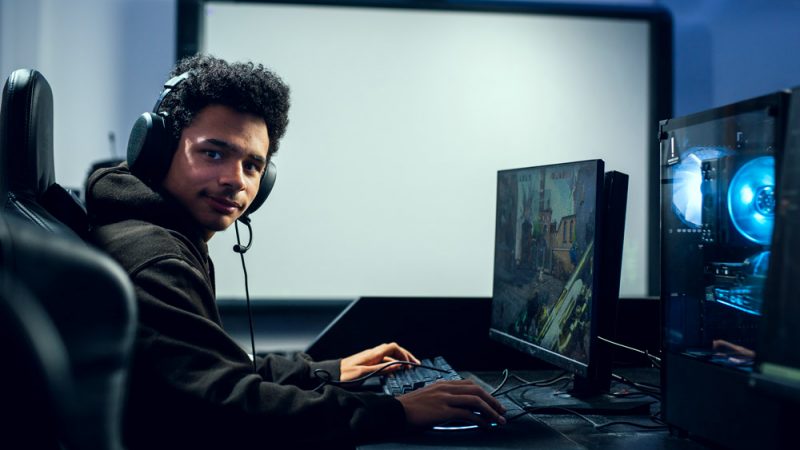 Esports Computing Student Competing on Gaming Computers