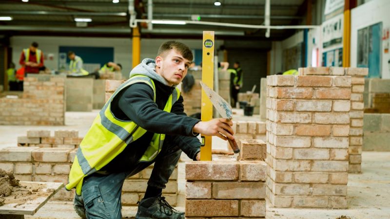 Construction Brickwork Student Measuring Height Using Spirit Meter