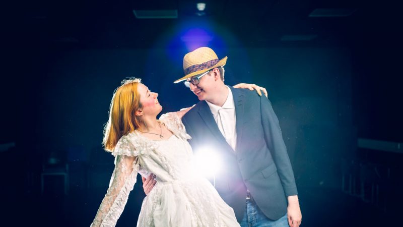 Male and Female Performing Arts Students Wearing Costumes and Dancing