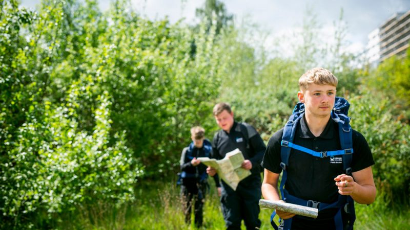 Three Male Public Services Hiking and Orienteering